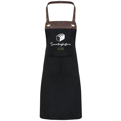 Backschürze in Schwarz mit Lederriemen und Aufdruck Sauerteigflüsterin