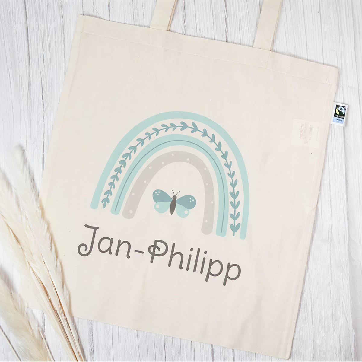 Stofftasche aus Bio- Baumwolle mit Name | Regenbogen mint + Schmetterling