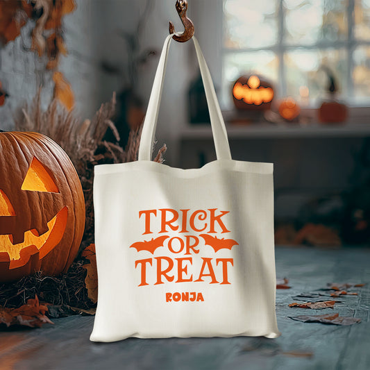Stofftasche aus Bio- Baumwolle mit Namen | Trick or Treat orange